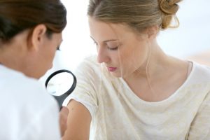 Woman with Magnifying Glass