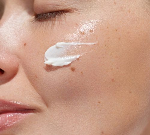 cream,smear.,beauty,close,up,portrait,of,young,woman,with